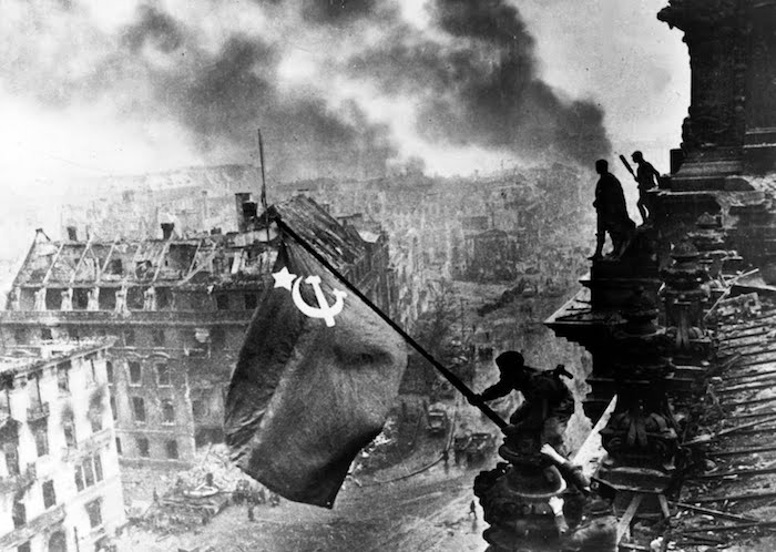 Red Army Soldiers Raising The Soviet Flag on The Roof of The Reichstag Berlin Germany
